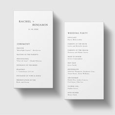 two white wedding programs with the wording in black and white on top of them