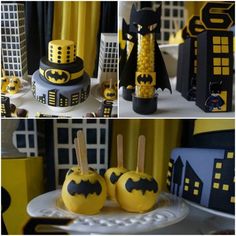 the cake is decorated with yellow and black icing, batman decorations, and corn on the cob