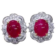 A pair of exquisite earrings feature a stunning design in Art Deco style, so delicate gems and brilliant diamonds. Crafted with refined details, the soft and feminine design adds a touch of elegance to any ensemble . The combination of the radiant red rubies and sparkling diamonds creates a dazzling and sophisticated look. Gorgeous earrings come in 18k gold with 2 pieces of Natural Burma Rubies, extra fine quality, spectacular color, in perfect oval/cabochon cut , of 11,00 carat, and 174 pieces of Natural Diamonds, in baguettes and round brilliant cut, of 3,60 carats, F color VS clarity, so bright diamonds. Handcrafted by artisan goldsmith. Excellent manufacture and quality of gems. Complete with AIG report. Whosale price. Note: no taxes on my shipment. Blink Blink, Radiant Red, 18k Gold Earrings, Oval Earring, Estilo Art Deco, Ruby Diamond, Feminine Design, Brilliant Diamond, Art Deco Style