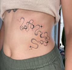 a woman with a tattoo on her stomach