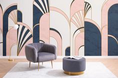 a chair and ottoman in front of a wall with an art deco design on it