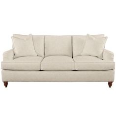 a white couch with pillows on it