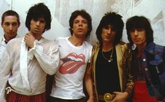 the rolling stones are posing for a photo