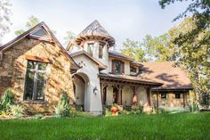 a large house with a turret shaped roof