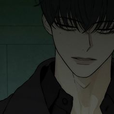 an anime character with dark hair and black shirt looking at the camera while standing in front of a green wall