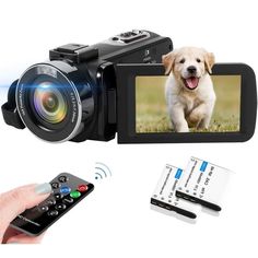 a person holding a remote and a camera with the image of a dog on it