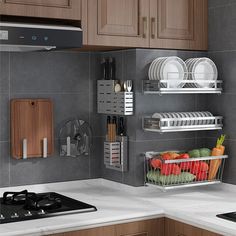 a kitchen with wooden cabinets and stainless steel shelves holding plates, bowls, knives and utensils