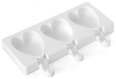 three heart shaped ice cream molds in a white tray on a white table top