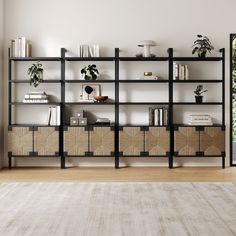 a living room filled with lots of books and furniture