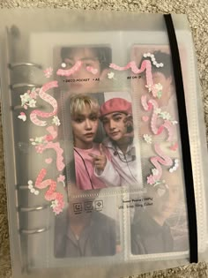 two young people are shown in a plastic bag with pink and white flowers on it