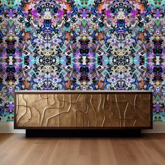 an artistic wallpaper design with gold and purple accents on a wooden cabinet in front of a wood floor