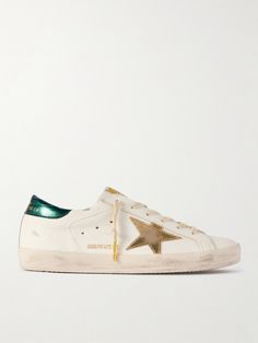 EXCLUSIVE AT NET-A-PORTER. Golden Goose's 'Super-Star' sneakers have been a fan favorite since their debut in 2007. This version is made from smooth white leather contrasted by metallic trims, including the signature applique and heel tab. They're distressed by hand and have metal-tipped laces. Golden Goose Shoes, Golden Goose Deluxe Brand, Jo Malone London, Star Sneakers, Super Star, Shoe Closet, Distressed Leather, Golden Goose, Ski Wear