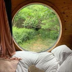 a round window in the side of a bed