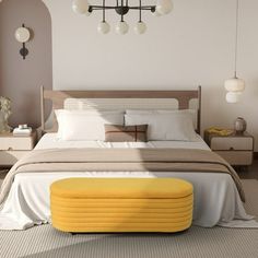 a bedroom with a large bed and yellow foot stool in front of the headboard