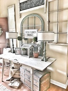 a table with two lamps and a sign that says fresh flower market next to it