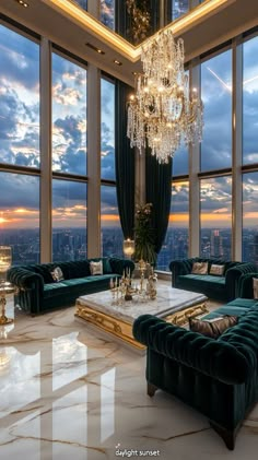 a living room with large windows and a chandelier