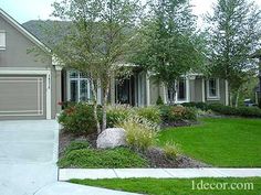 a house with landscaping in front of it