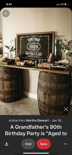 an image of a birthday party with wine barrels and chalkboard sign on the wall