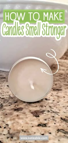 a candle sitting on top of a counter next to a bowl with candles in it