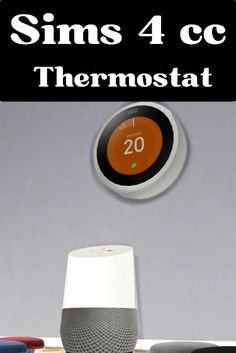 thermostat is next to an alarm clock on top of a table with other items