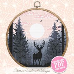 a cross stitch pattern with a deer in the woods at sunset, on a pink background