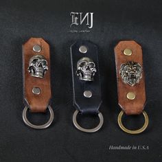 three different types of key chains with skulls on them