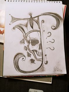 a drawing of a skull with a trumpet in it's mouth next to a cell phone