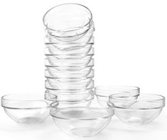 a stack of clear glass bowls sitting next to each other