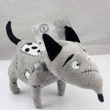 a stuffed animal dog with a tag on it's ear and nose is shown in front of a white background