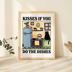 a framed poster with a black cat sitting in front of a refrigerator that says kisses if you do the dishes