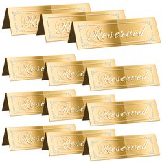 six gold reserved name tags on white background