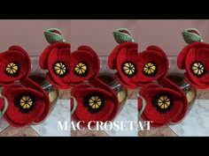 crocheted red apples sitting on top of a marble counter next to each other