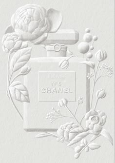 an image of a chanel perfume bottle with flowers on the front and back side