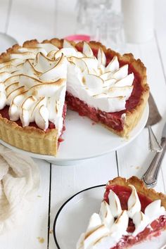 a piece of pie on a plate with a fork and knife next to the pie