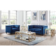 a living room filled with blue couches and tables