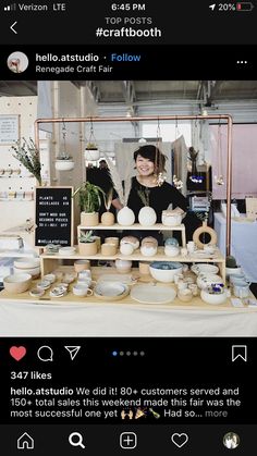 a woman standing behind a table with plates and bowls on it