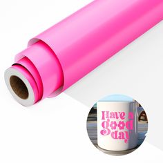 a pink coffee mug with the words have a good day printed on it next to a white background