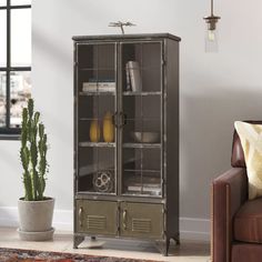 a living room with a couch, chair and bookcase