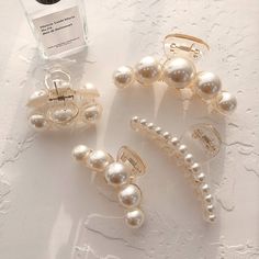 PRICES MAY VARY. 💖Pearl Hair Claw : 4 different sizes for your reference,big size(4.1 inch), medium size(2.75inch), small size(1.7inches), long size(3.94inches). 4 combinations meet your daily needs. 💖Material: Using high-quality resin and strong spring material, it can even clamp very thick hair. Use artificial highlight pearls so the surface is very smooth, you don’t have to worry about damaging your hair when wearing or losing hair. The pearl also is made of plastic. 💖Application: Hair cli Fine Hair Styles For Women, Autumn Hair Accessories, Pearl Hair Clips, Rhinestone Hair Pin, Hair Clamps, Pearl Hair Clip, Hair Accessories Clips, Claw Hair Clips, Hair Accessories Gift