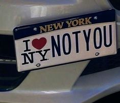 a new york license plate that says i love ny not you on it's front bumper