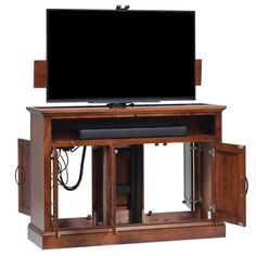 an entertainment center with a flat screen tv on top