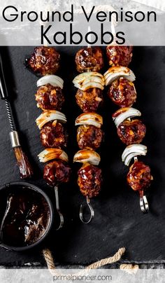 meatball kabobs on skewers with sauce