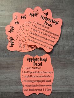 three pink tags with instructions for applying vinyl decals