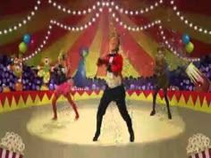 a group of people standing on top of a ice rink in front of a circus tent