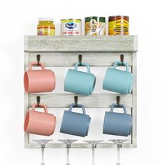 a wooden rack with cups and mugs hanging from it