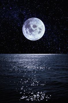 the full moon shines brightly in the night sky over the water's surface