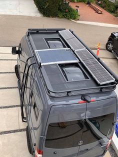 an suv with solar panels on the roof