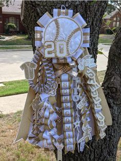 a baseball themed birthday decoration on a tree