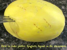 a fork stuck into a yellow squash with the words how to make perfect spaghetti in the microwave