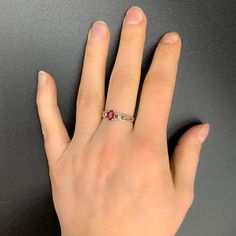 Handmade, antique ruby ring in 925 silver. It was manufactured in Germany in the 1960s and professionally reworked by a goldsmith in the 2000s.The ring has a 925 stamp inside and is studded with a ruby (approx. 6 mm x 4 mm x 1.5 mm). It is size 16 (56 1/2 or 7 3/4 in USA/ PQ in UK) More precisely the inside ring measures 19 mm x 19 mm x 2 mm at the narrowest point. The outer dimensions of the ring are 21 mm x 24 mm x 6 mm. The ring weighs 12,410 carats.On request with certificate of authenticity Pink Ruby Ring With Accent Stones For Promise, Pink Ruby Rings With Prong Setting, Lab-created Ruby Ring With Center Stone, Pink Ruby Birthstone Ring With Prong Setting, Ruby Birthstone Ring With Pink Center Stone, Formal Pink Ruby Ring In Sterling Silver, Ruby Ring With Accent Stones For Promise, Pink Ruby Ring With Rose Cut Diamonds For Promise, Classic Pink Ruby Rings